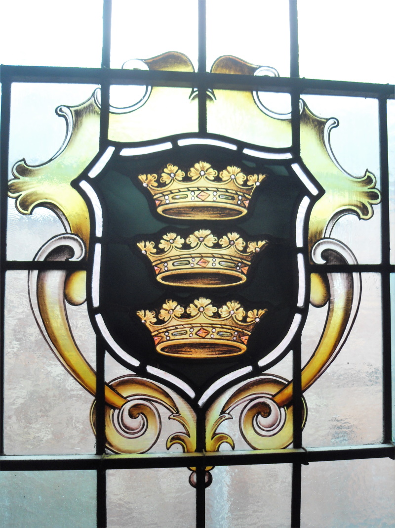 The town’s heraldic shield and charter affixed to a window