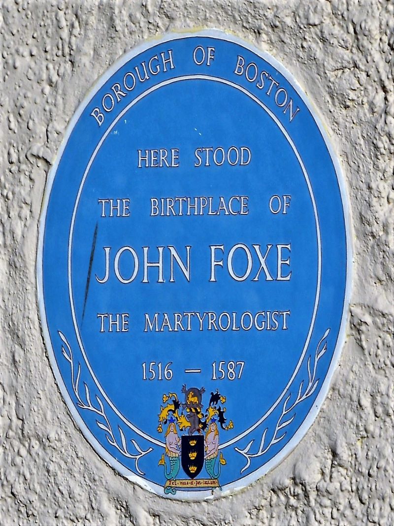 A blue plaque, showing where John Foxe's birthplace is in market square.